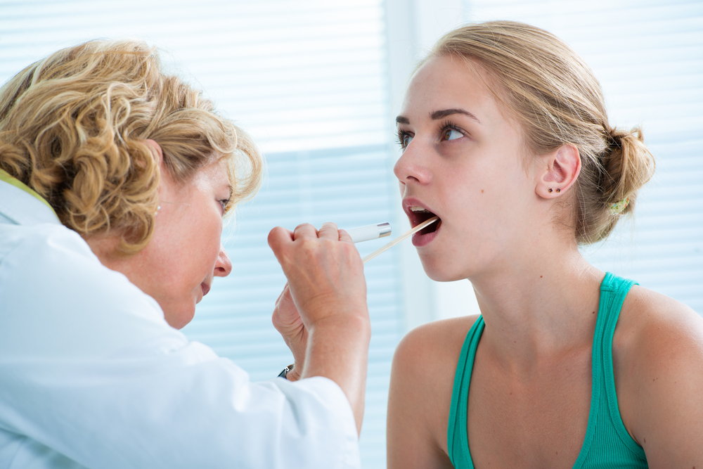 Doctor checking kid patient’s heartbeat.