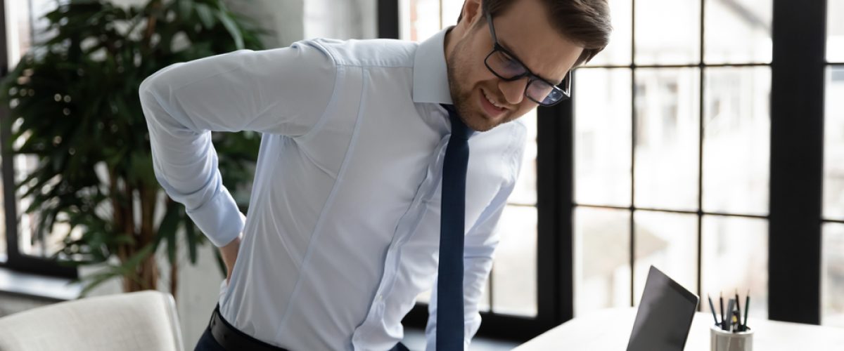 Unhappy,Unwell,Male,Employee,Suffer,Sitting,In,Incorrect,Posture,At