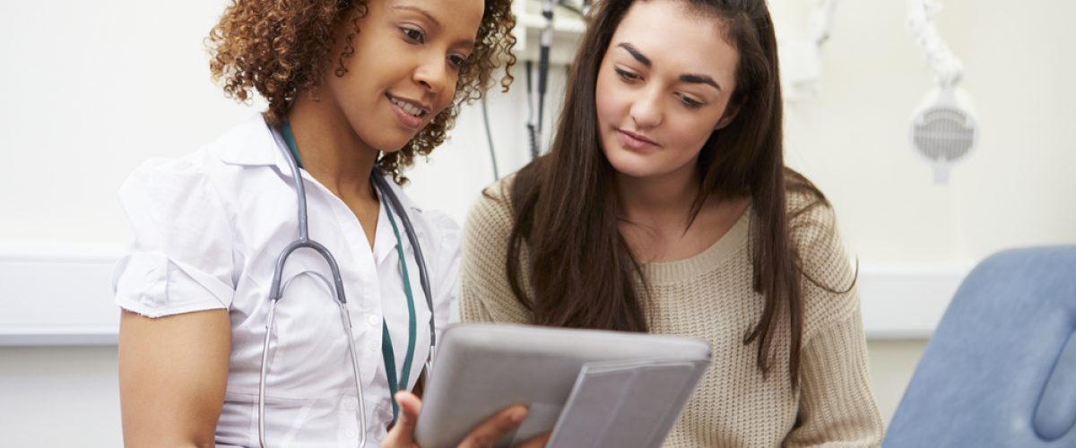 Female doctor with college student