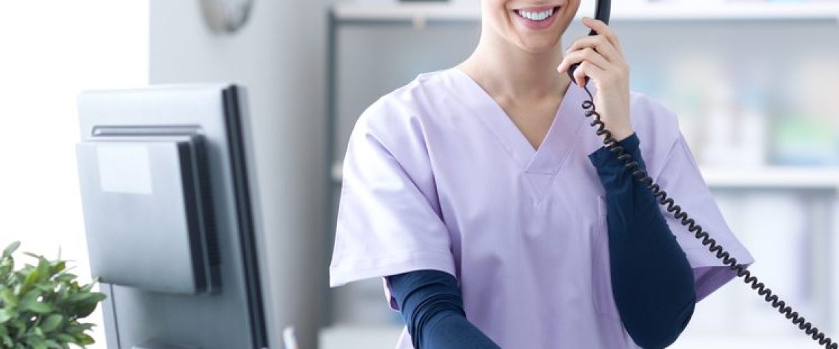 Young,Practitioner,Doctor,Working,At,The,Clinic,Reception,Desk,,She
